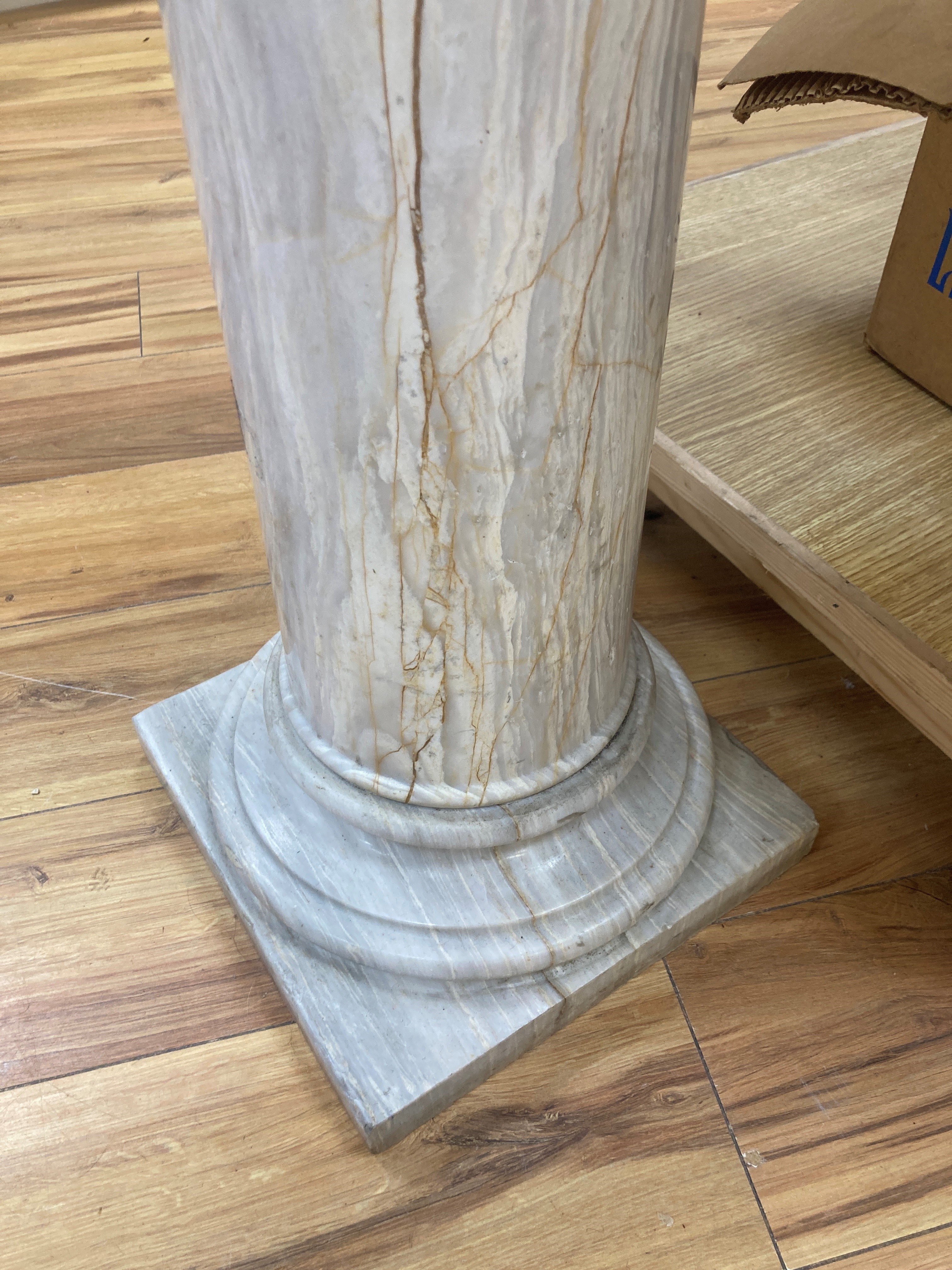 A white marble tazza on associated column stand 120cm high (combined) 43cm diameter (tazza)